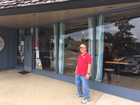 Bill Thomas, the owner of Northern Illinois Windows, stands outside the Hidden Pearl Café in McHenry. Hidden Pearl is one of the customers that rely on NIW to keep their windows clean.